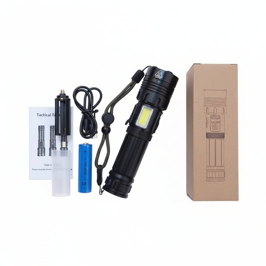 Black flashlight with accessories on a wooden surface