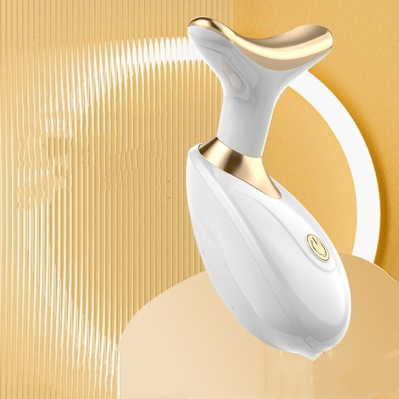 White and gold electronic device on a beige background